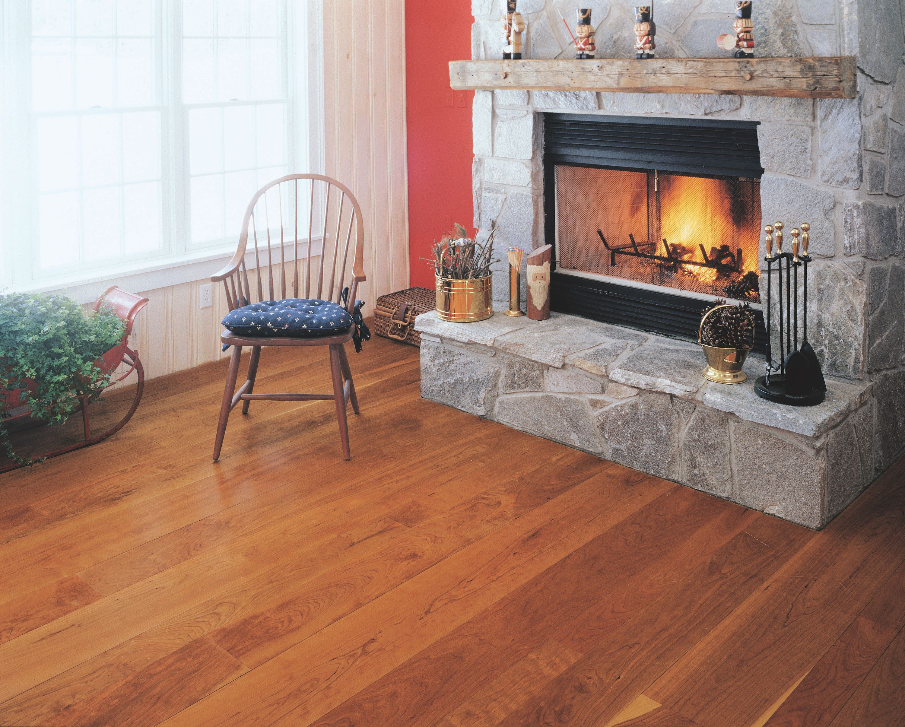 Cherry Wood Flooring with a Stone Fireplace